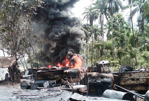 soldiers destroying illegal refineries