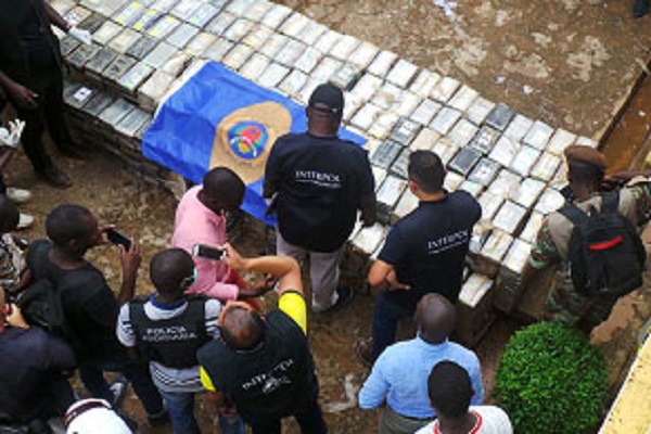 Interpol operatives examing another drug seizure in Guinea Bissau