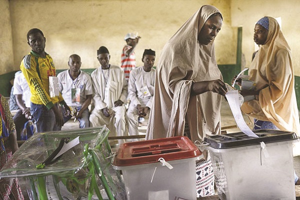 A Nigerian woman casts her vote during the 2019 general elections