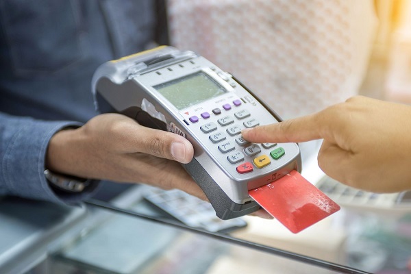 Customers making payments with PoS machine
